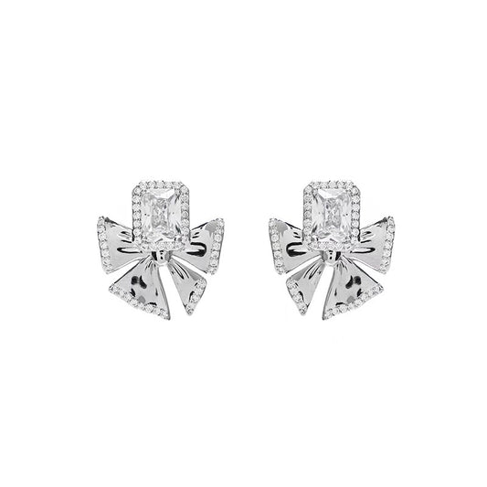 Silver Serenity: Crystal Bow Stud Earrings for a Sweet & Edgy Look